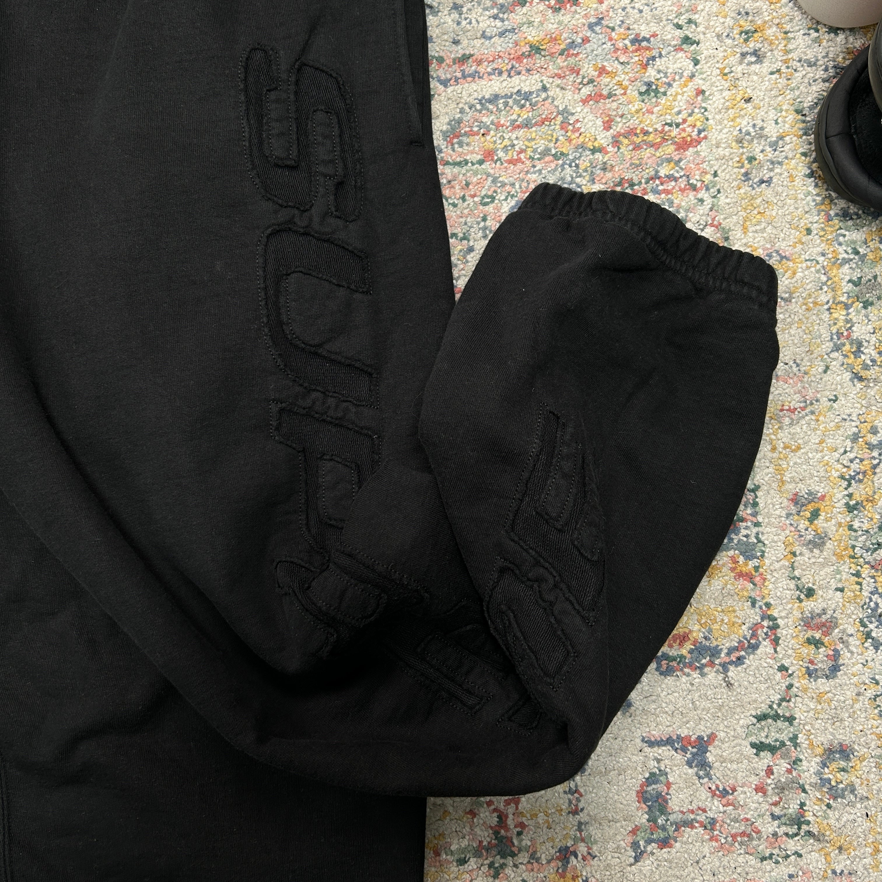 SUPREME CUTOUT LOGO JOGGERS
