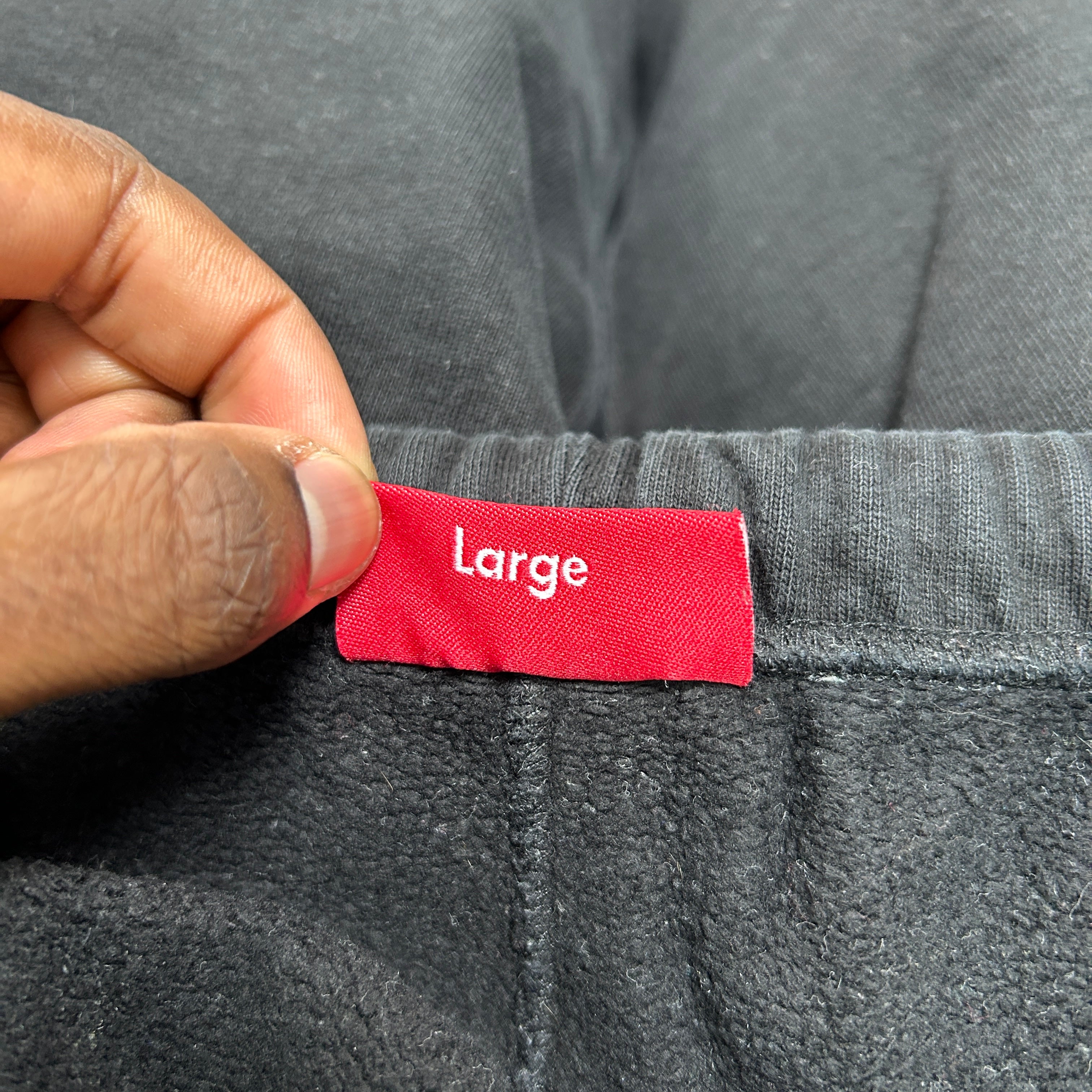 SUPREME CUTOUT LOGO JOGGERS
