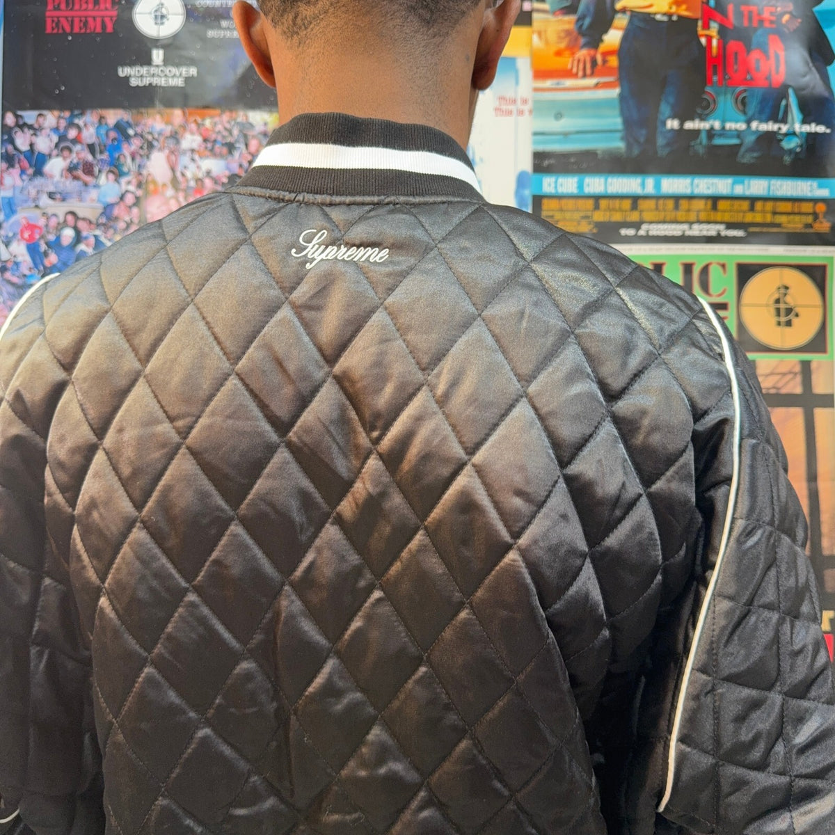 SUPREME FW26 CHAMPION QUILTED SATIN VARSITY BLACK JACKET
