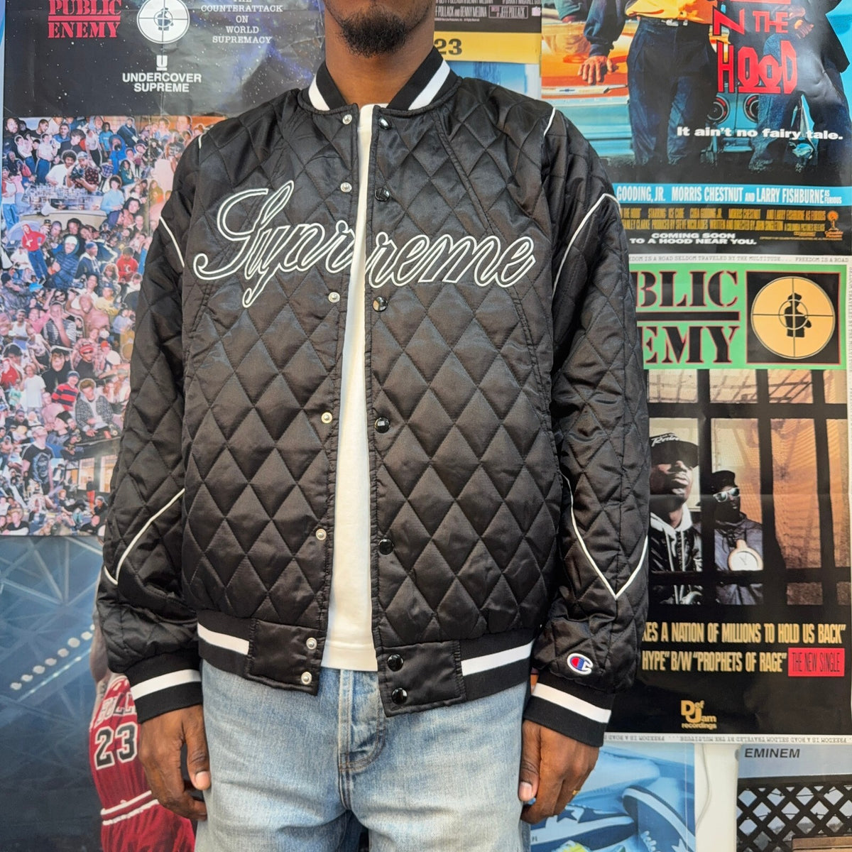 SUPREME FW26 CHAMPION QUILTED SATIN VARSITY BLACK JACKET
